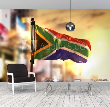 Picture of South Africa Flag Against City Blurred Background At Sunrise Backlight